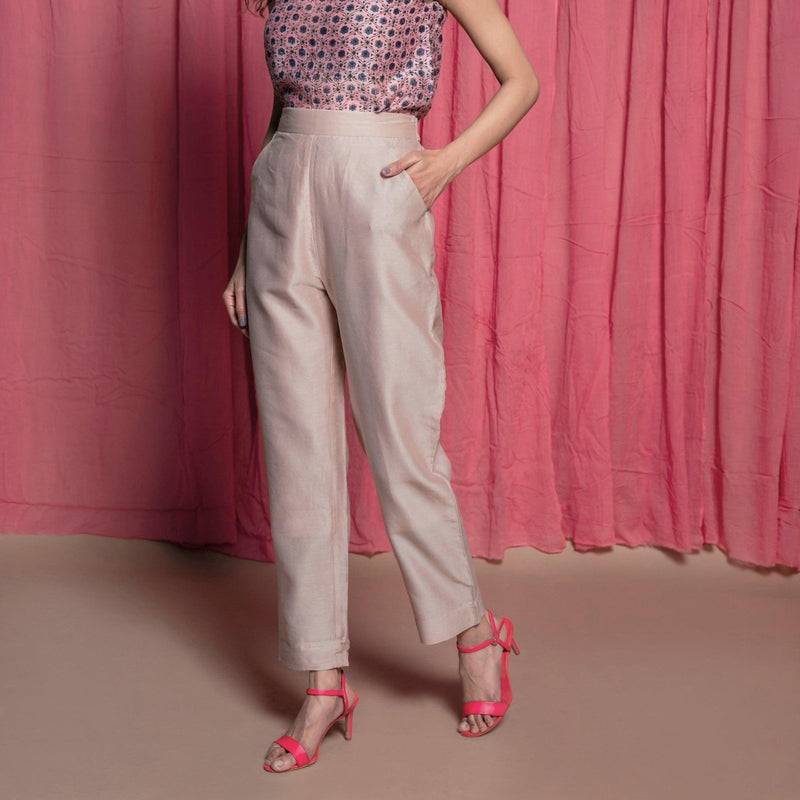 Left View of a Model wearing Champagne Cotton Chanderi Elasticated High-Rise Pant