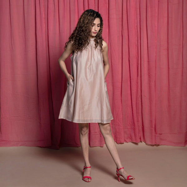 Right View of a Model wearing Champagne Cotton Chanderi Knee Length Tent Dress