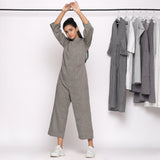 Front View of a Model wearing Charcoal Grey Handspun Straight Ankle Length Jumpsuit