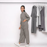 Left View of a Model wearing Charcoal Grey Handspun Straight Ankle Length Jumpsuit