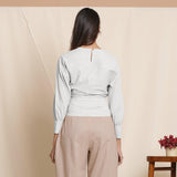 Back View of a Model wearing Cloudy Grey Striped Surplice Neck Blouson Top