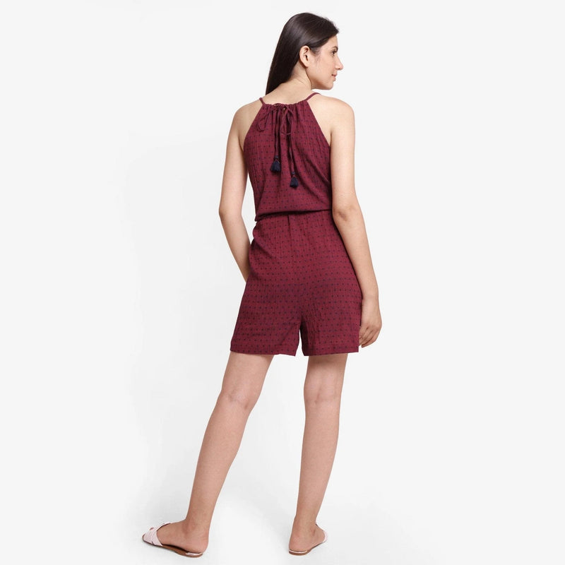 Back View of a Model wearing Crimson Polka Dot Halter Neck Romper