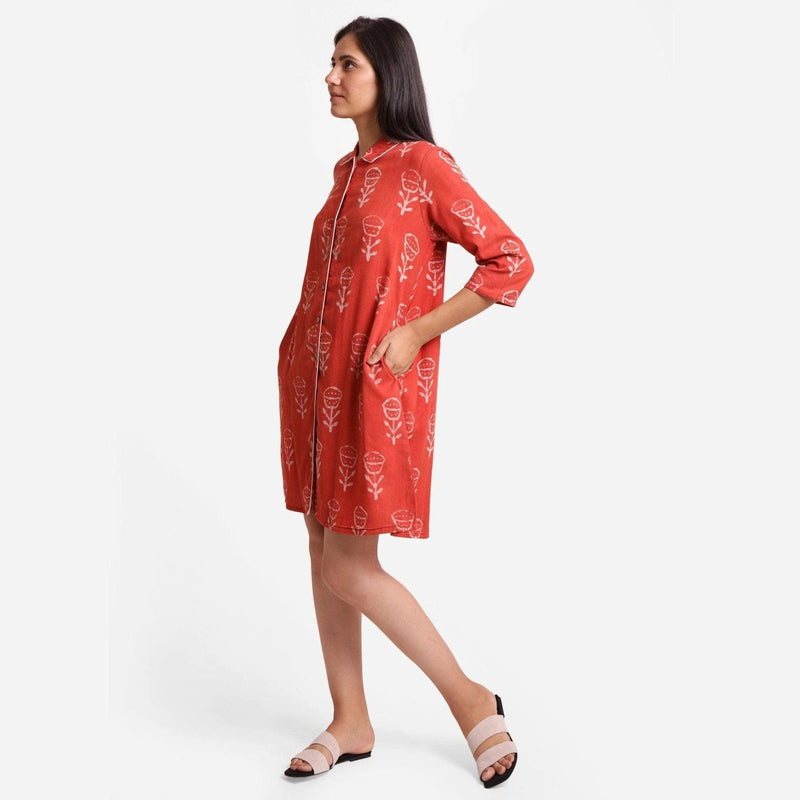 Left View of a Model wearing Dabu Hand Block Print Orange Button-Down Dress