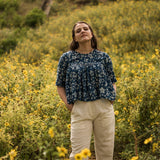 Front View of a Model wearing Natural Dyed Dabu Printed Gathered Top