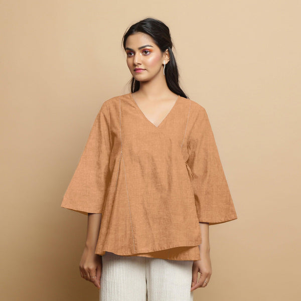 Front View of a Model wearing Desert Yellow 100% Linen Asymmetrical Godet Top