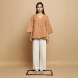 Front View of a Model wearing Desert Yellow 100% Linen Asymmetrical Godet Top