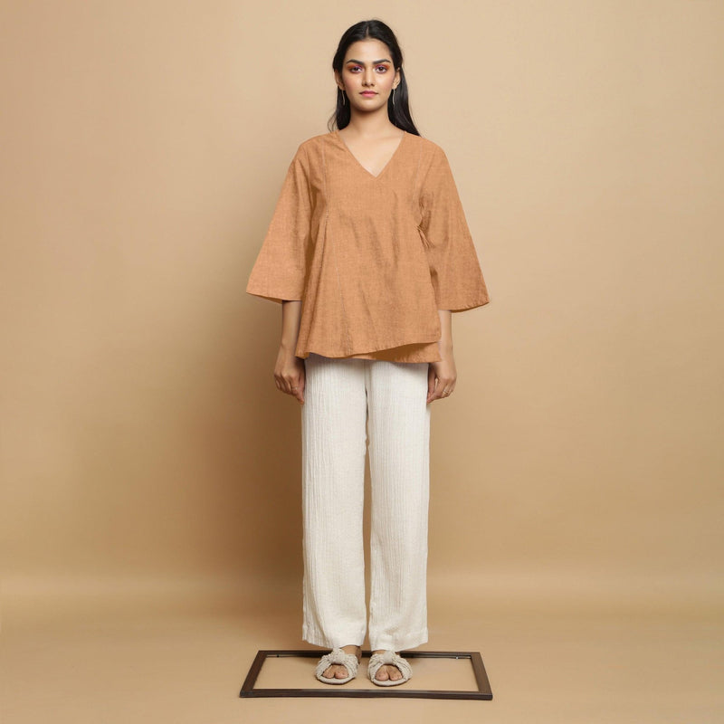 Front View of a Model wearing Desert Yellow 100% Linen Asymmetrical Godet Top