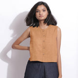 Front View of a Model wearing Desert Yellow 100% Linen Button-Down Short Top