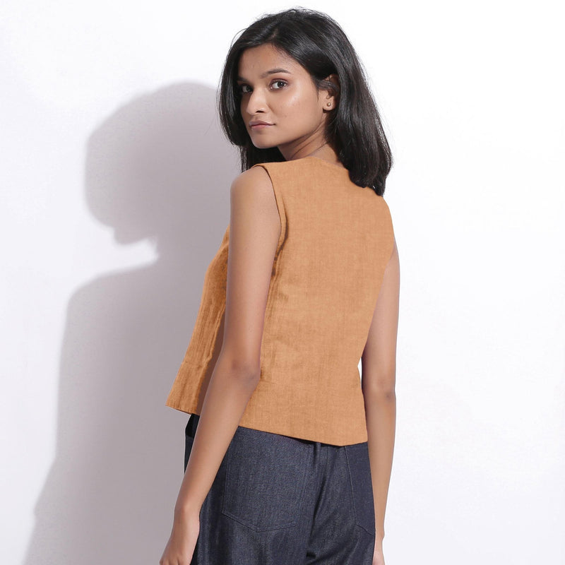 Back View of a Model wearing Desert Yellow 100% Linen Button-Down Short Top