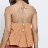 Back Detail of a Model wearing Desert Yellow 100% Linen Halter Neck Handkerchief Top