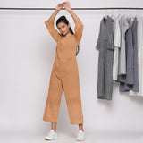 Front View of a Model wearing Desert Yellow 100% Linen High Neck Jumpsuit