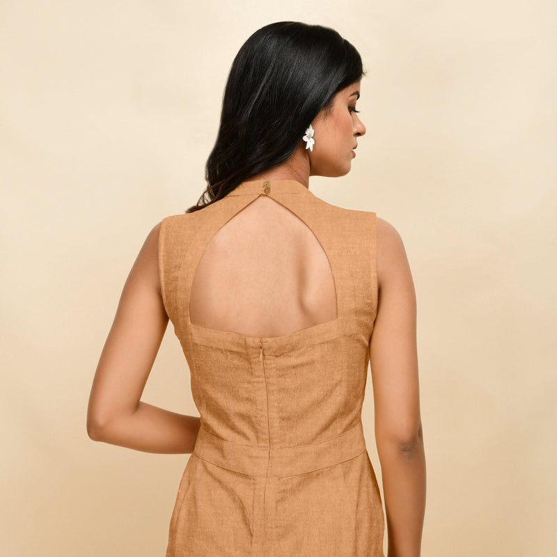 Back Detail of a Model wearing Desert Yellow 100% Linen Princess Line Sleeveless Jumpsuit