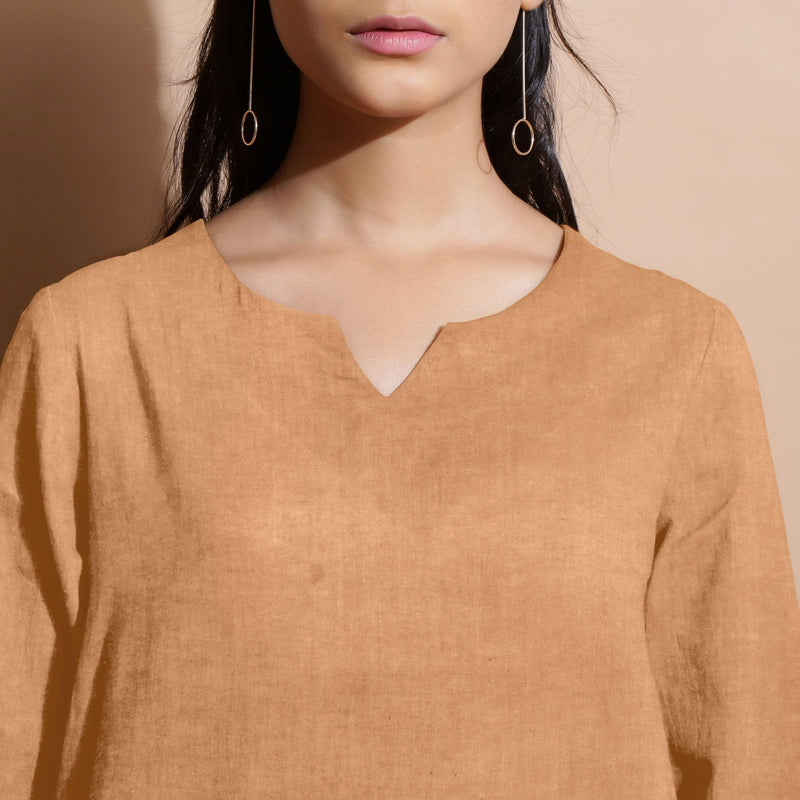 Front Detail of a Model wearing Desert Yellow 100% Linen Split-Neck Tunic Top