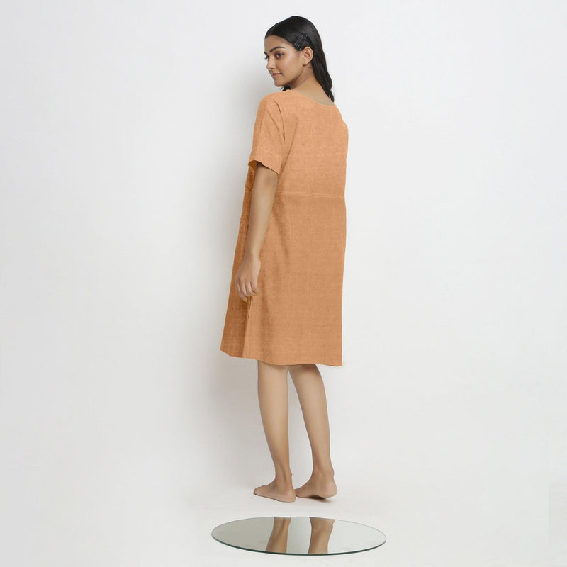 Back View of a Model wearing Desert Yellow Linen Knee Length Yoked Dress