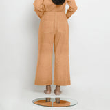 Back View of a Model wearing Desert Yellow Linen Patch Pocket Wide Legged Pant