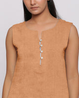 Front Detail of a Model wearing Desert Yellow Linen Split Neck Button-Down Sleeveless Top