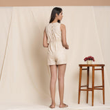 Back View of a Model wearing Cotton Dusk Beige Striped Sleeveless Romper