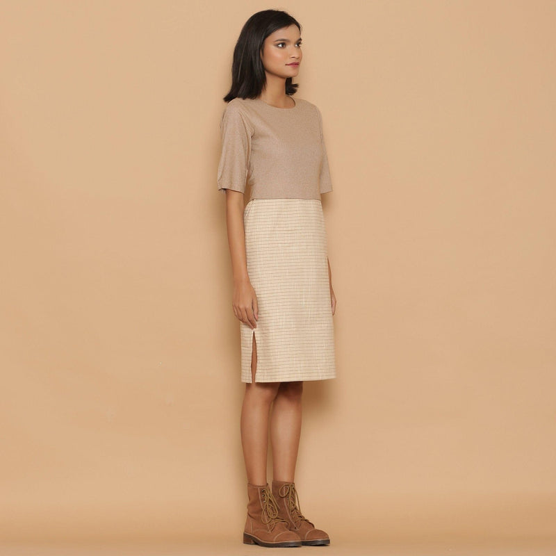 Right View of a Model wearing Dusk Beige Slim Fit Shift Dress