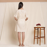 Back View of a Model wearing Dusk Beige Cotton Striped Sack Dress