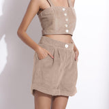 Front Detail of a Model wearing Dusk Beige Cotton Corduroy Baggy Shorts