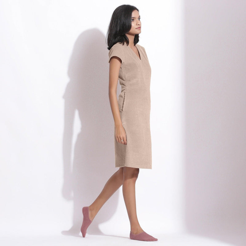 Right View of a Model wearing Dusk Beige Cotton Corduroy V-Neck Dress