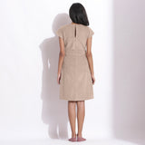 Back View of a Model wearing Dusk Beige Cotton Corduroy V-Neck Dress