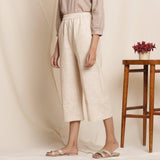 Left View of a Model wearing Dusk Beige Warm Cotton Culottes Striped Pant