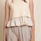 Front Detail of a Model wearing Beige Striped Surplice Blouson Top