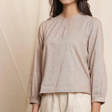 Front Detail of a Model wearing Dusk Brown Straight Gathered Top