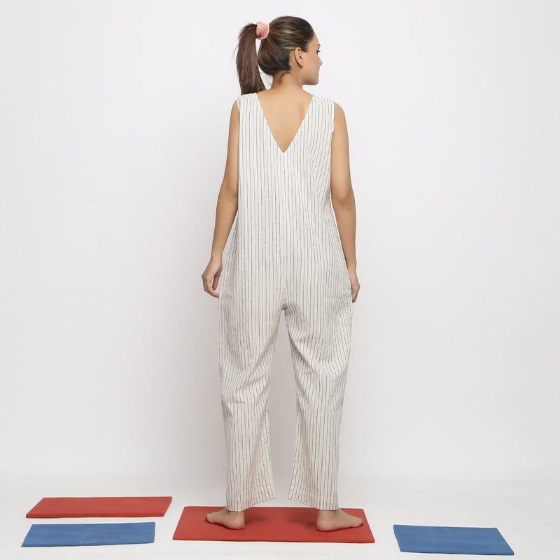 Back View of a Model wearing Ecru and Blue Striped Vegetable Dyed Cotton Sleeveless Jumpsuit