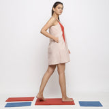 Right View of a Model wearing Ecru and Red Vegetable Dyed Handspun Cotton Short Dress