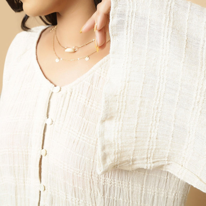 Right Detail of a Model wearing Ecru Cotton Flax Frilled Button-Down Top