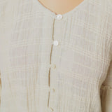 Front Detail of a Model wearing Ecru Cotton Flax Frilled Button-Down Top