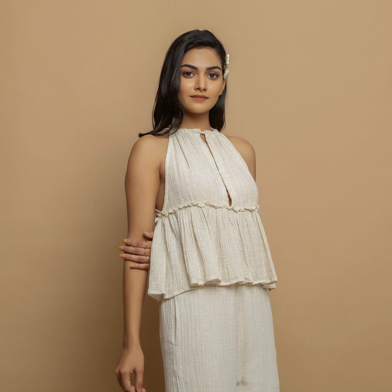 Right View of a Model wearing Ecru Cotton Flax Sleeveless Flared Top