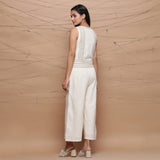 Back View of a Model wearing Handspun Ivory Jute Laced Jumpsuit