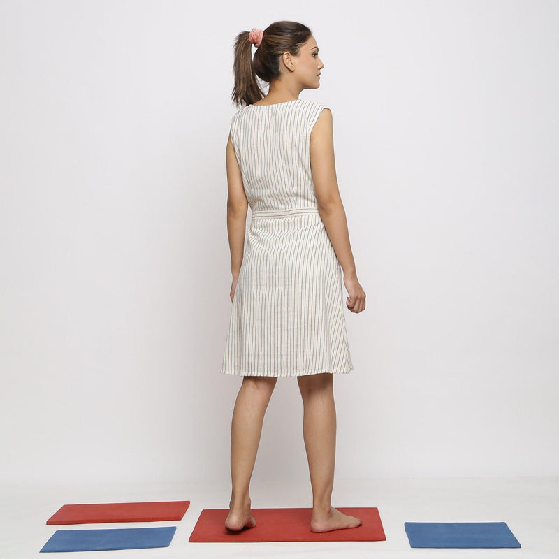 Back View of a Model wearing Vegetable Dyed Ecru Button-Down Dress