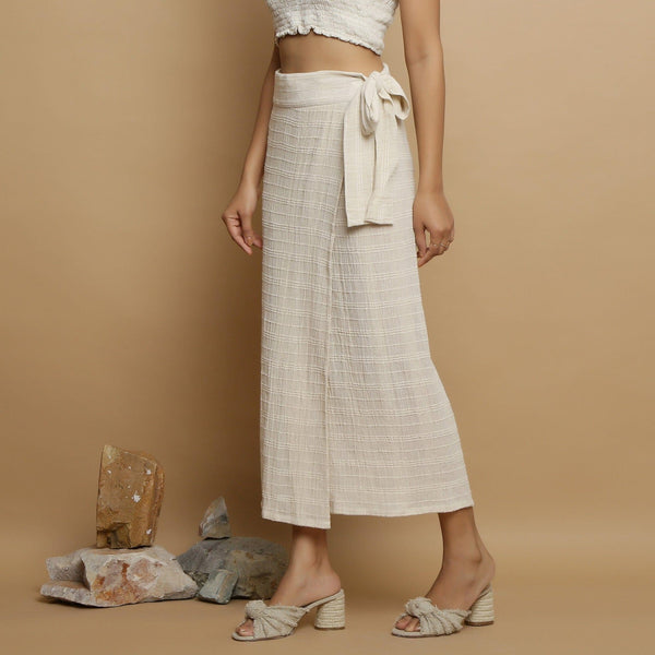 Left View of a Model wearing Undyed Banded Cotton Flax Wrap Skirt