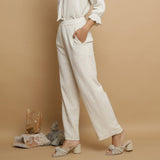 Left View of a Model wearing Undyed Elasticated Mid Rise Ecru Pant