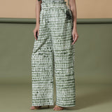 Left View of a Model wearing Fern Green Shibori Paperbag Pant