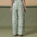 Back View of a Model wearing Fern Green Shibori Paperbag Pant