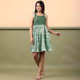 Front View of a Model wearing Dark Green Shibori Gathered Short Dress