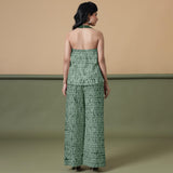 Back View of a Model wearing Dark Green Shibori Halter Neck Flared Top