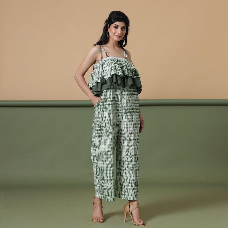 Right View of a Model wearing Fern Green Shibori Frilled Camisole Jumpsuit