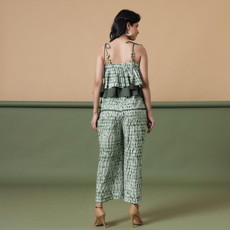 Back View of a Model wearing Fern Green Shibori Frilled Camisole Jumpsuit