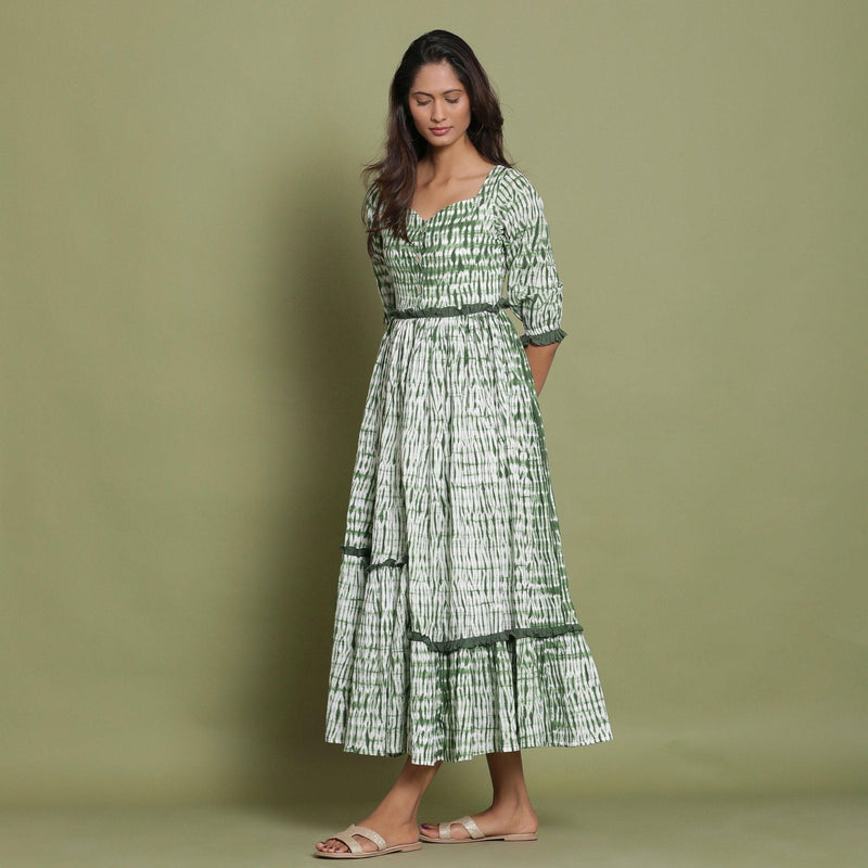 Left View of a Model wearing Green Shibori Asymmetrical Tier Maxi Dress