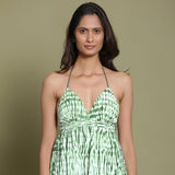 Front Detail of a Model wearing Dark Green Shibori Halter Neck Gathered Dress