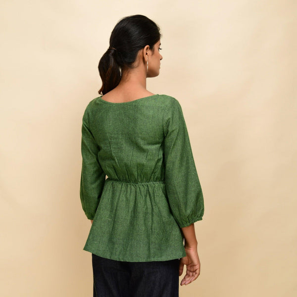 Back View of a Model wearing Forest Green 100% Cotton Round Neck Peplum Top