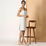 Right View of a Model wearing Frosted White Cotton Flax Strappy Slit Dress