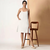 Front View of a Model wearing Frosted White Cotton Flax Strappy Slit Dress