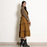 Right View of a Model wearing Golden Oak Tier Pinafore Frilled Dress